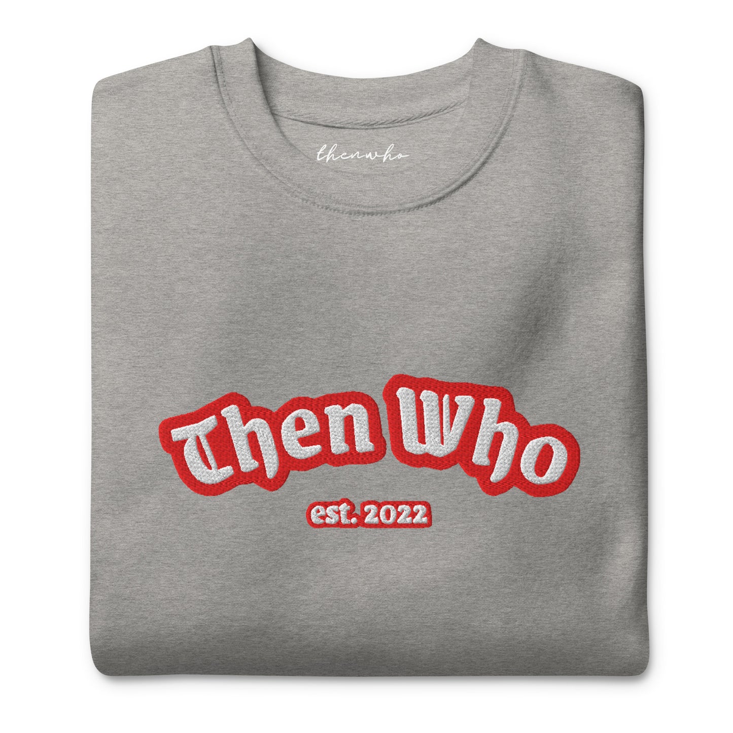 Folded gray sweatshirt with 'Then Who est. 2022' text in red and white on a white background
