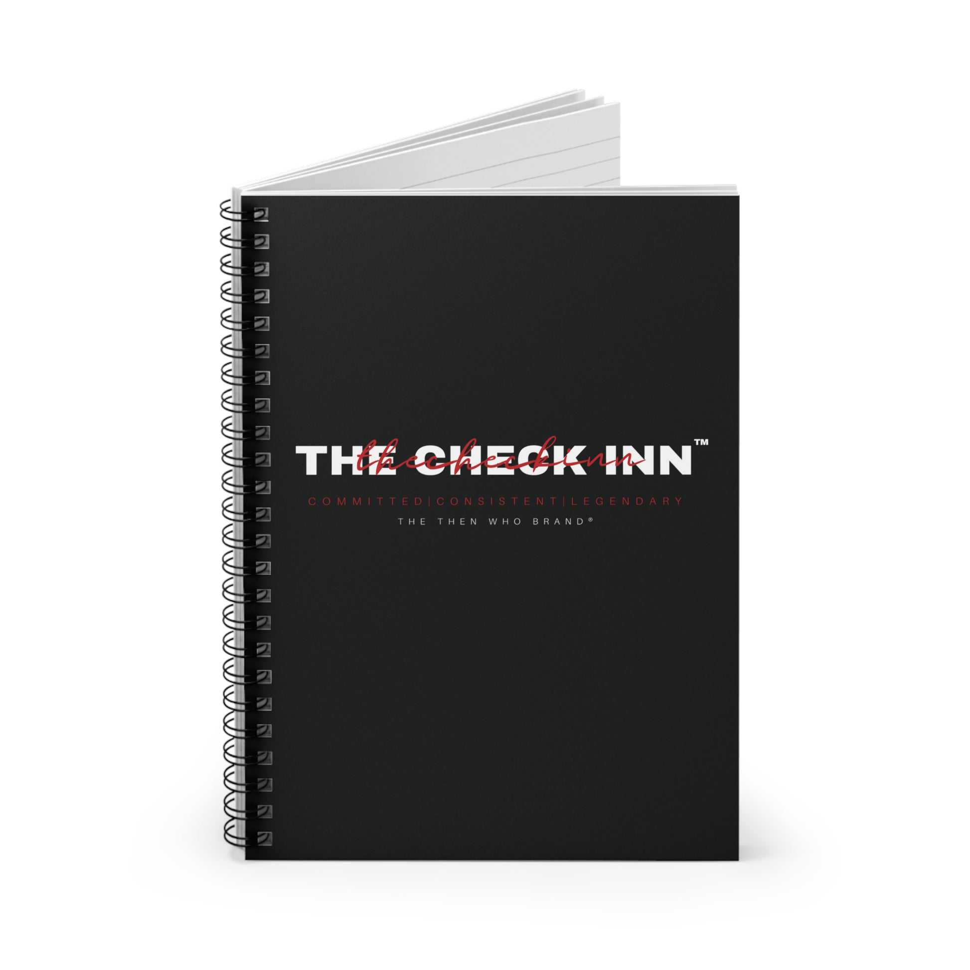 Black notebook with 'The Check Inn' branding on a white background