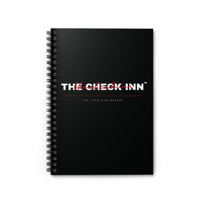Black notebook with 'The Check Inn' branding on a white background