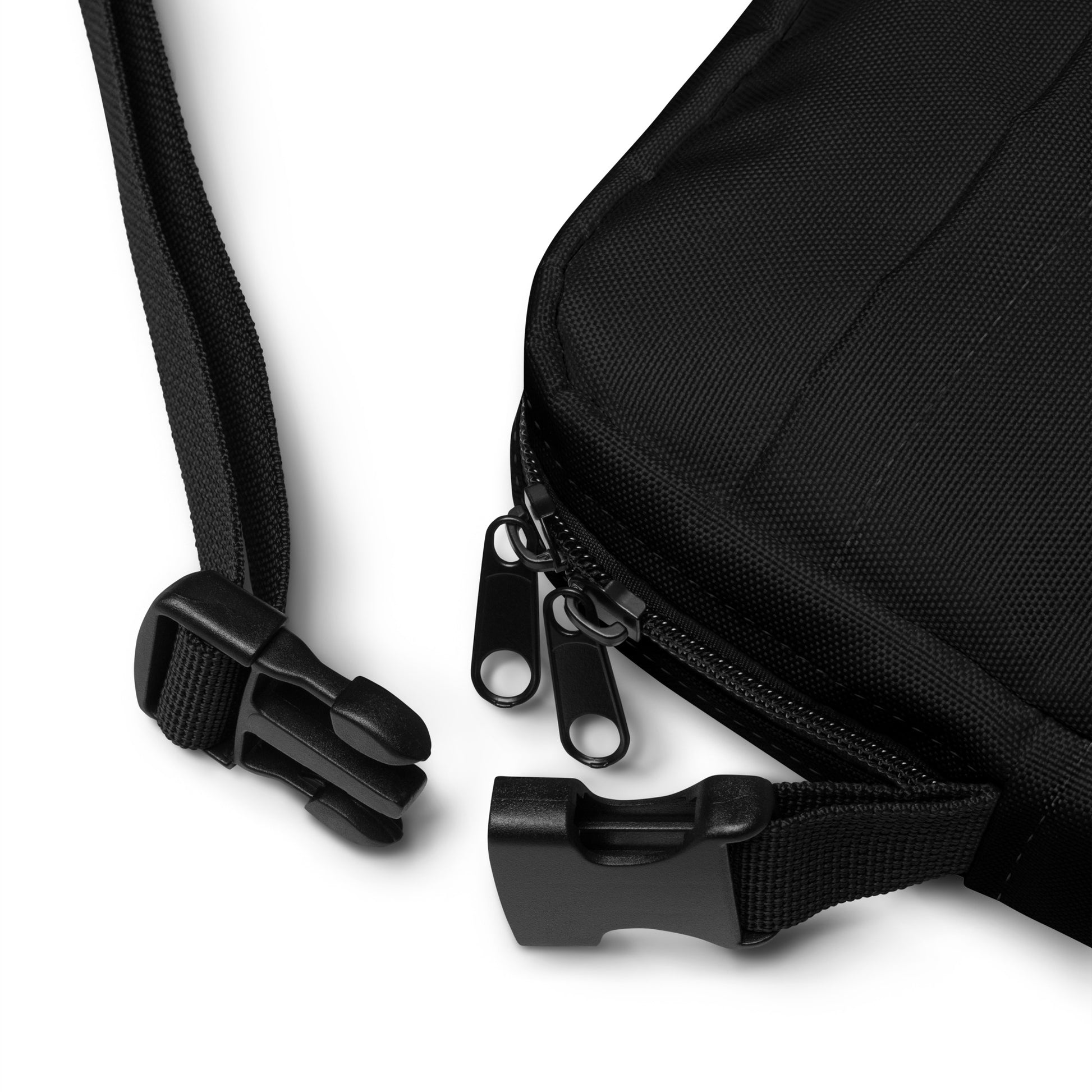 Black bag with zipper and strap on a white background