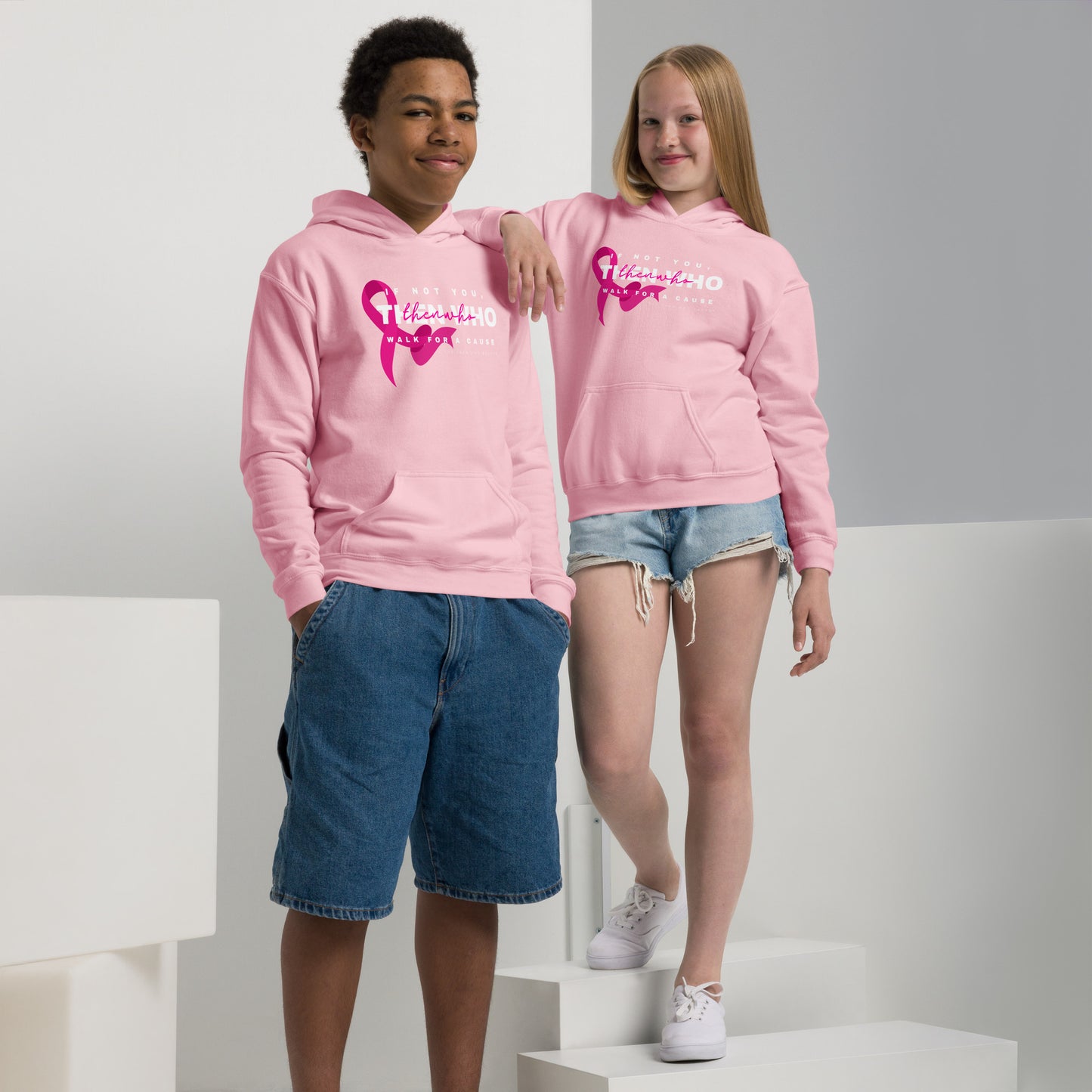 Two people wearing pink hoodies with a logo on a white background